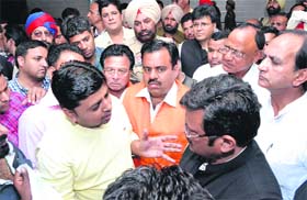 United they oppose: BJP workers talk to state party chief president Kamal Sharma, expressing opposition to the partys Hoshiarpur Lok Sabha candidate Vijay Sampla, in Jalandhar on Wednesday