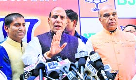 BJP president Rajnath Singh (centre) with Raju Srivastava (left) and Jagdambika Pal in Delhi