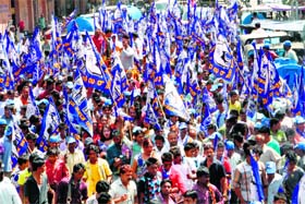 Workers of the Bahujan Samaj Party take out a rally in Dehradun