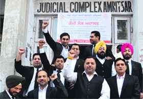 Advocates at the district courts complex during a no work, no pay protest on Thursday. 