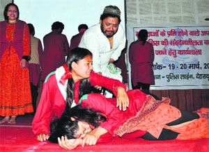 Artistes perform during a workshop on crime against women at police lines in Dehradun on Thursday.