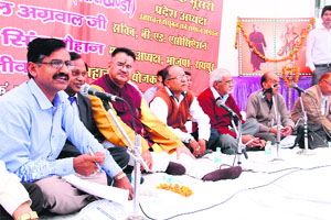 Artistes during a hasya kavi sammelan at DBS PG College in Dehradun on Thursday. 