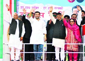AICC vice-president Rahul Gandhi waves to a crowd as he arrives to address a public rally at the Netaji Subhas Chander Bose Stadium in Dharamsala on Thursday
