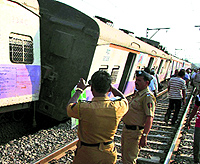 A local train derails on the Central Line between Ambivali and Titwala stations in Mumbai on Thursday