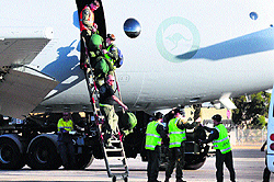 Royal Australian Air Force (RAAF) crew members from of an AP-3C Orion maritime patrol aircraft walk down a ladder after they arrived in Perth on Thursday after searching an area in the southern Indian Ocean for the Malaysia Airlines flight MH370