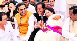 Former union minister Harmohan Dhawan hugs BJP candidate Kirron Kher after announcing his support to her at Khuda Ali Sher in Chandigarh on Friday