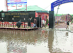 Water drained out from a residential complex by Fire Department inundated the gate of the National Institute of Technology, Srinagar, causing inconvenience to people