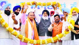 BJP candidate from Amritsar Arun Jaitley with state party chief Kamal Sharma and Chief Minister Parkash Singh Badal at a rally in Attari on Friday