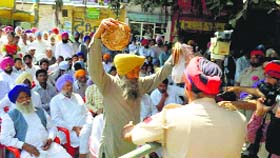 Chief Minister Parkash Singh Badal was taken by surprise when a farmer showed him rotis prepared from "sub-standard" wheat distributed under the Atta-Dal scheme