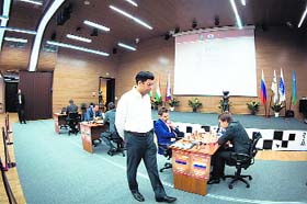 Viswanathan Anand, who played out a draw with Peter Svidler, walks past Levon Aronian and Sergey Karjakin at the Candidates Chess tournament on Friday