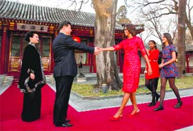 CEMENTING TIES: US first lady Michelle Obama and her daughters is greeted by Chinese President Xi Jinpingand his wife Peng Liyuan in Beijing
