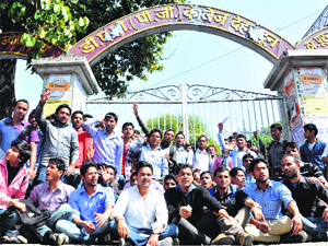 Students protest at DAV PG College in Dehradun on Saturday.