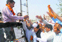AAP convener Arvind Kejriwal interacts with residents during a road show in Faridabad on Saturday. A Tribune photo