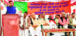 Leader of Opposition PK Dhumal addresses a party workers' meeting at Basdehra village in Una on Saturday. Photo: Rajesh Sharma