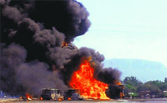 Vehicles in flames after an oil tanker collides with auto-rickshaws in Thane on Saturday. PTI