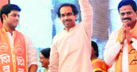 Shiv Sena chief Uddhav Thackeray waves to supporters at the party workers meet in Airoli, Navi Mumbai, on Saturday. pti