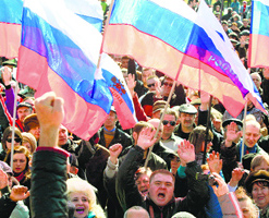 Pro-Russian activists wave Russian flags during a rally in the Ukrainian city of Donetsk on Saturday.