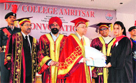 Students being conferred degrees by Arun Kumar Grover Vice-Chancellor, Panjab University, Chandigarh, during the 56th convocation of DAV College, Amritsar, on Sunday.
