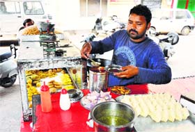 Parmanand prepares pakoras at his shop in Haathi Wala Mandir Street in Bathinda