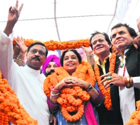 BJP candidate Kirron Kher flanked by Harmohan Dhawan, Satya Pal Jain and Gurcharan Singh Kala (extreme right) at a function in Mani Majra on Sunday