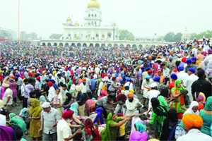 Thousands of Kar Sevaks cleaning the Sarovar of Gurdwara  Bangla Sahib in New Delhi on Sunday.