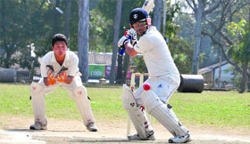 Players in action during the District Cricket League at the OFD ground in Dehradun on Sunday.