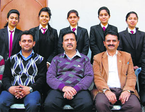 Dharamsala College toppers pose with Principal RP Chopra and other teachers after the declaration the results of Himachal Pradesh Technical University on Saturday