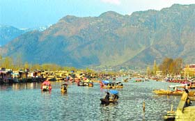 Tourists enjoy a shikara ride in Dal Lake