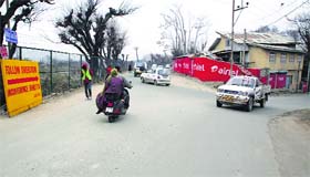 Vehicles at an intersection near the Mehjoor Bridge in Srinagar