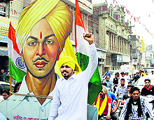 Activists of a social group hold a march to pay tributes to Shaheed Bhagat Singh on the occasion of his martyrdom day in Jalandhar on Sunday