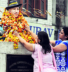 BJP activists garland a statue of Shaheed Bhagat Singh at Bhagat Singh Chowk in Jalandhar on Sunday