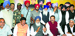 Chief Minister Parkash Singh Badal addresses Akali-BJP workers while campaigning for BJP candidate from Hoshiarpur Vijay Sampla (second from right) on Sunday