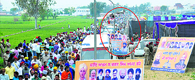 Flouting the Election Commissions guidelines, loudspeakers and political hoardings (encircled) of Akali leaders hang from streetlights near Bhagat Singhs memorial at Khatkar Kalan in Nawanshahr on Sunday