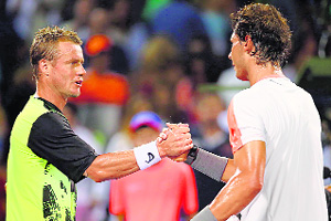 Leyton Hewitt congratulates Rafael Nadal after their match during the Sony Open in Miami on Saturday.