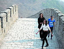 US First Lady Michelle Obama shares a lighter moment with her daughters Malia, front, and Sasha as they visit the Mutianyu section of the Great Wall of China in Beijing on Sunday
