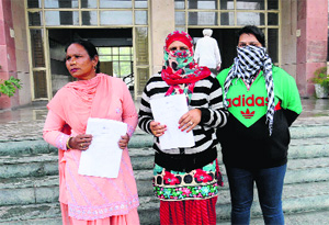 The complainant (centre) who accused BSP candidate of exploitation and cheating outside the SSPs office in Bathinda on Monday.