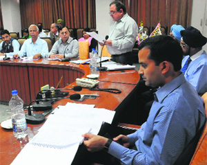 The Deputy Commissionmer discusses district credit plan for the year 2014-15 with bank officials in Bathinda on Monday.