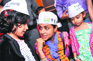 AAP candidate Gul Panag interacts with children during her campaign in Sector 22 on Monday