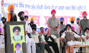 SAD candidate for the Anandpur Sahib constituency Prem Singh Chandumajra addresses a rally at the grain market in Kharar on Monday.
