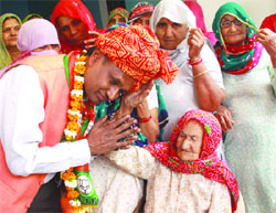 The BJP candidate from the North West constituency, Udit Raj, during a campaign in the Bawana area on Monday.