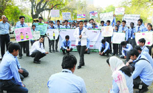 Students holding placards during a demonstration to observe World Tuberculosis (TB) Day at Jantar Mantar in New Delhi on Monday