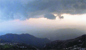 Clouds hover over Doon Valley as seen from Mussoorie on Monday.