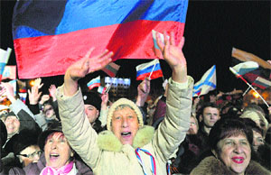 Pro-Russian Crimeans celebrate after 95.5 per cent of the voters supported Crimea's union with Russia. AFP file photo 