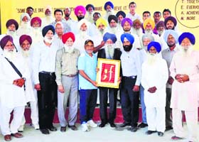 Office-bearers of the Sher-e-Punjab Sports Academy, Chakar, felicitate internationally acclaimed marathon runner Fauja Singh