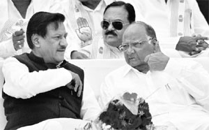 NCP chief Sharad Pawar with Maharashtra Chief Minister Prithviraj Chavan at an election rally in Satara, Maharashtra, on Monday.