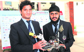 Gurumohit Singh Grover and Sagar Rawat won an award for making a robot during a technical festival at IIT, Roorkee, on Tuesday.