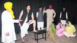Artistes perform in a nukkad natak on Shaheed Bhagat Singh organised by the SFI at the HPU auditorium in Shimla on Tuesday.