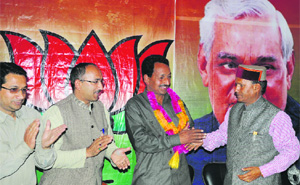 HLP leader Nand Lal after he joined the BJP in Mandi on Tuesday.