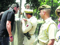 Policemen issue a challan for violating provisions of COTPA in Jammu.