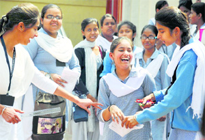 Students are all smiles after taking the Class X science examination of the Punjab School Education Board in Ludhiana on Tuesday.